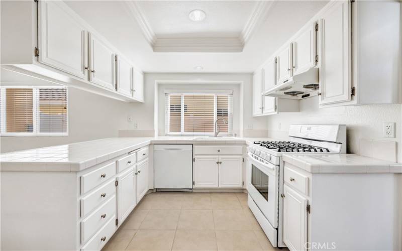 Kitchen with 5 burner gas stove.