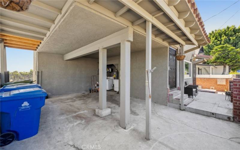 Downstairs unit has use of the laundry in the carport.  Two carport spaces up front.