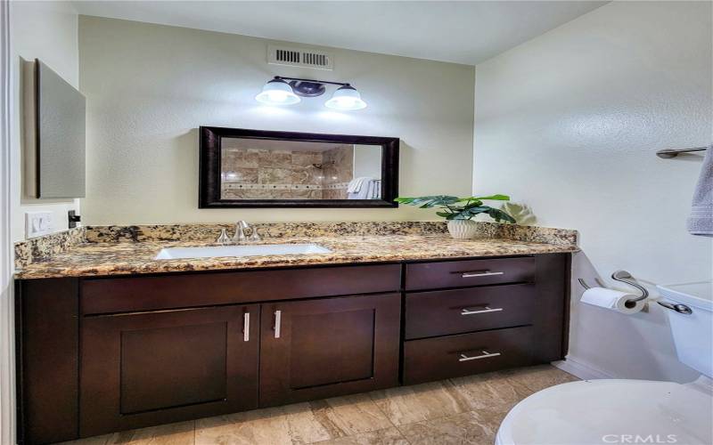 Master suite bath with upgraded vanity and lighting.