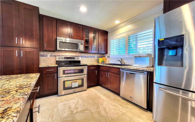 Recessed lighting and stainless steel appliances.