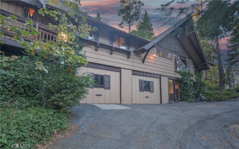 2 garages with access into lowest level. Left - 2 car tandem. Right - 1 car