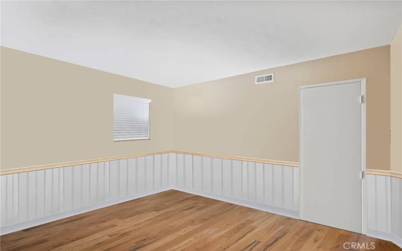 Downstairs bedroom virtually staged with personal contents removed