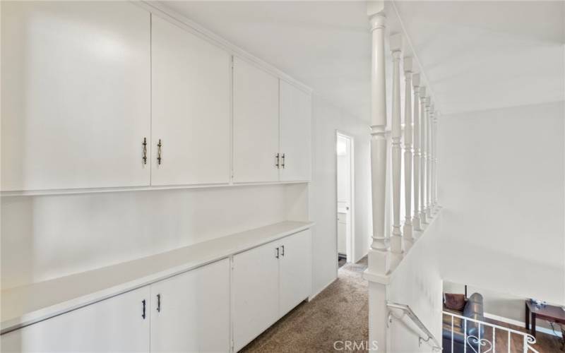 Upstairs hall with plenty of cabinet space for storage