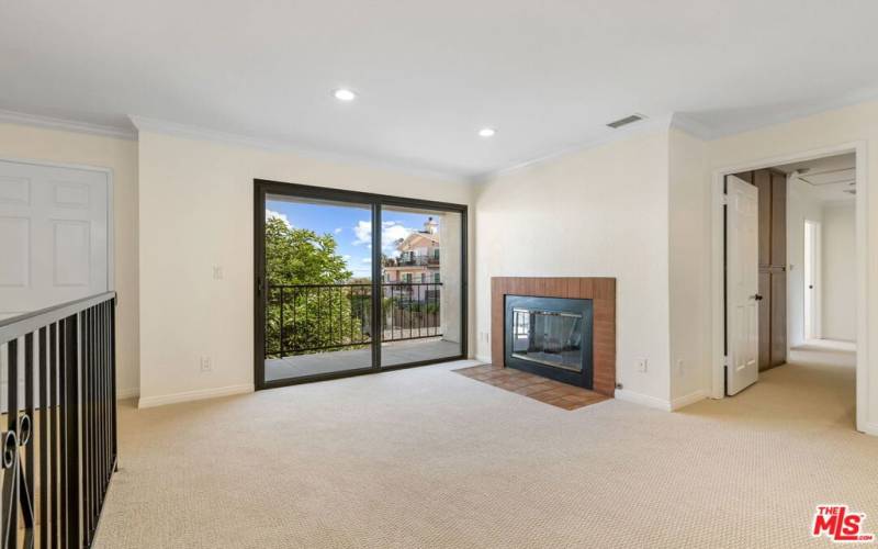 Living Room - Gas Fireplace - Balcony Facing East