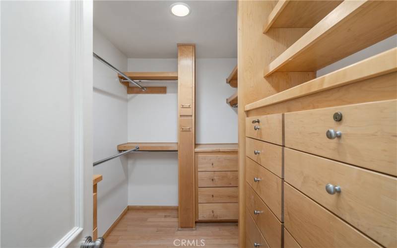 Primary Walk-in Closet with Built-in Cabinets