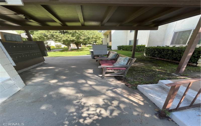 Sitting area across from mailboxes