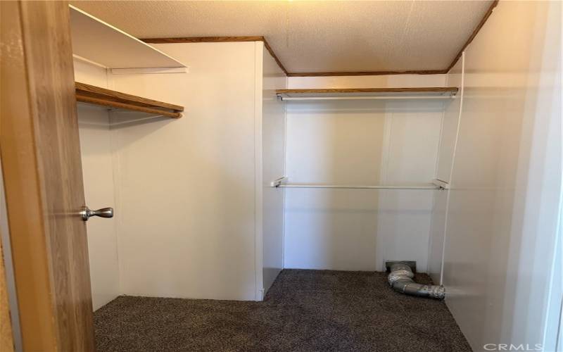 Walk-in closet in primary bedroom