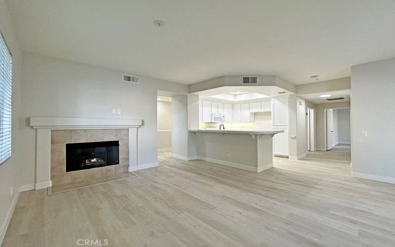 Living room with fireplace open to the kitchen