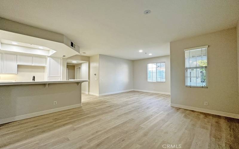 Living room with fireplace open to the kitchen