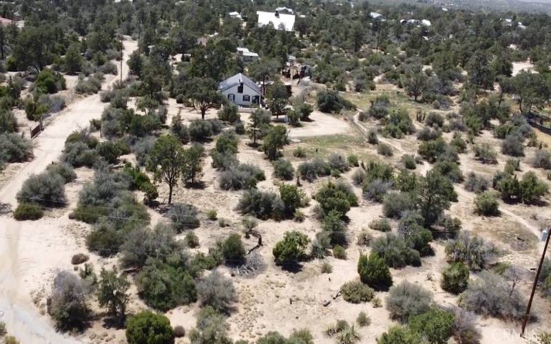 Above view of property and house