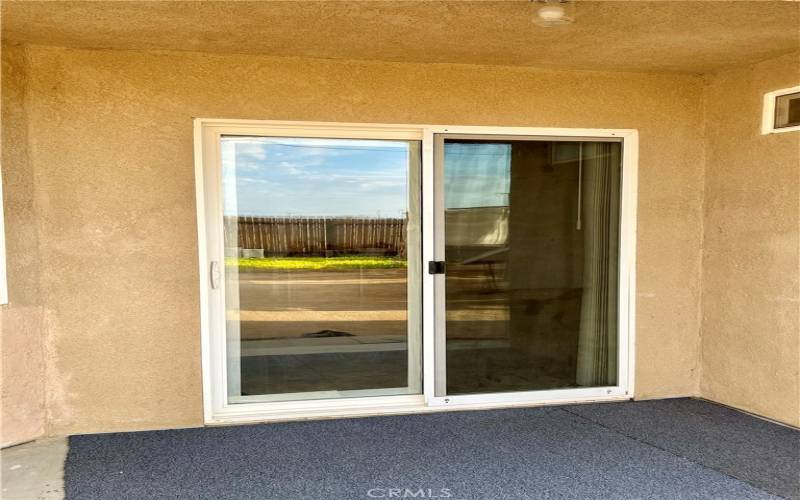 Sliding Door leads to Backyard.