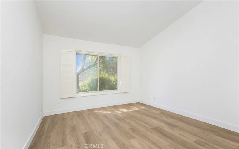 Primary Bedroom with window over looking backyard