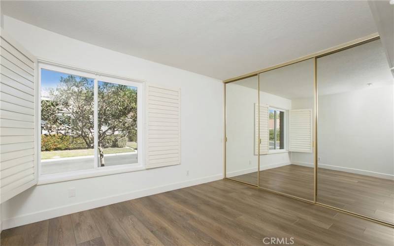 Bedroom #1 with plenty of closet space and window over looking front yard