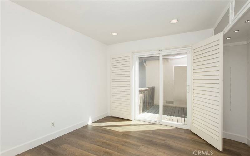 Bedroom #2 with Sliding door access to side yard patio area