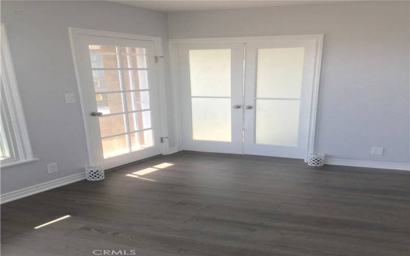 French doors to front bedroom off living room