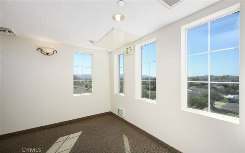 View from the west end of the 4th floor hallway where you will find the elevator closest to the the 407 assigned parking space