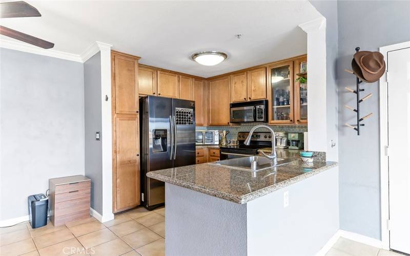 Kitchen with modern appliances, granite counters and lots of storage space