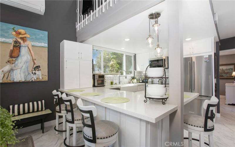 Chef's Kitchen with Counter Bar and Current Lighting.  New Shaker Cabinetry with Soft Close.  Mannington Waterproof LVT Tile.