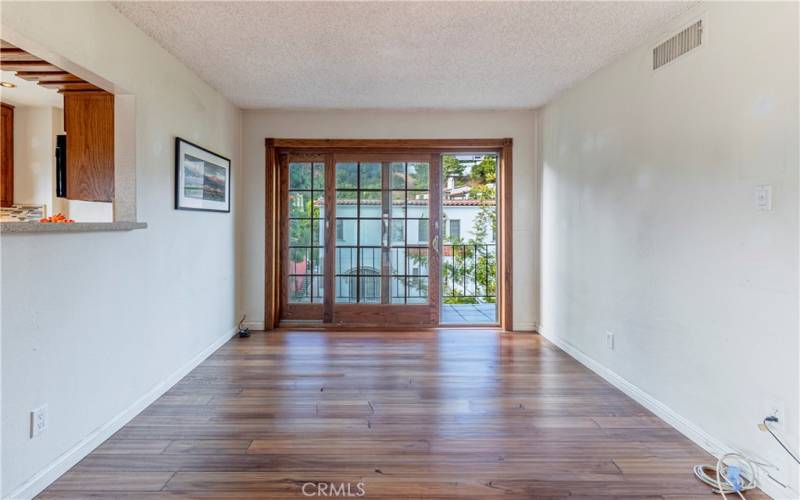 dining area, wood-framed sliding glass doors, balcony