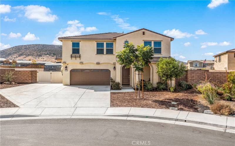 Front of house w extended driveway & RV parking to the left