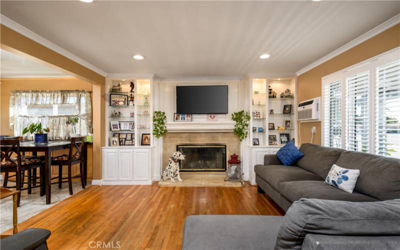 Beautiful built-ins on either side of an updated fireplace and mantle