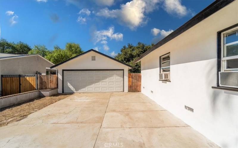 Long driveway and dettached garage.