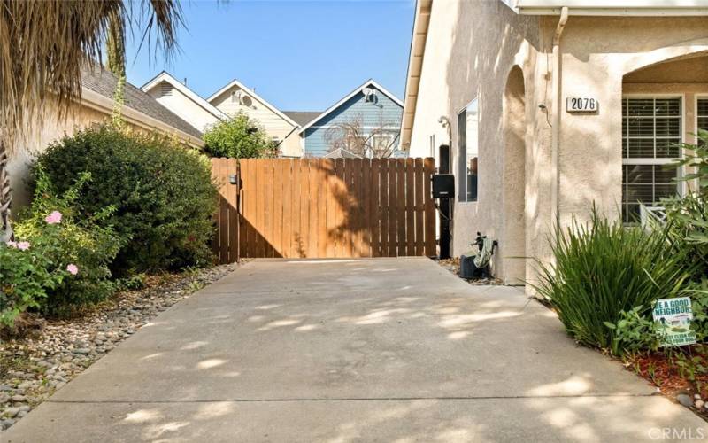 Long, private driveway with electric gate.