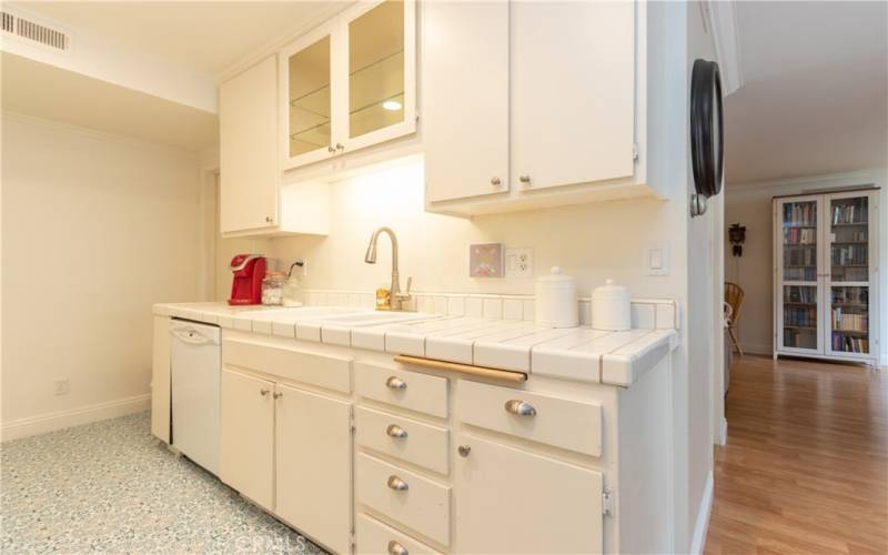 Crisp white cabinets and over the sink lighting.