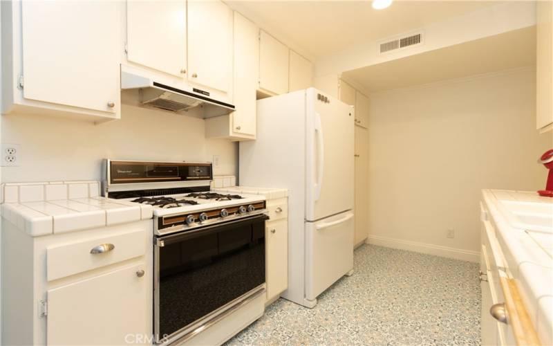 Matching appliances give a cohesive appearance to the kitchen.