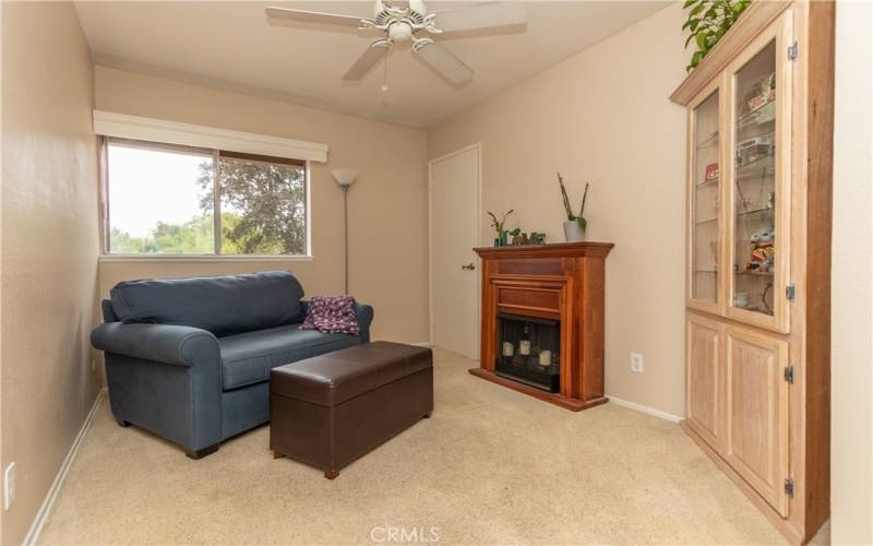 Third bedroom upstairs with ceiling fan.