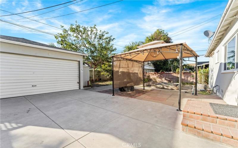 View of spacious back yard featuring detached 2 car  garage...lots of storage and parking