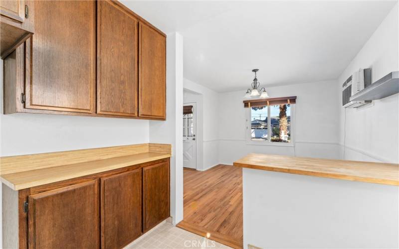 Galley kitchen showing ample cabinetry