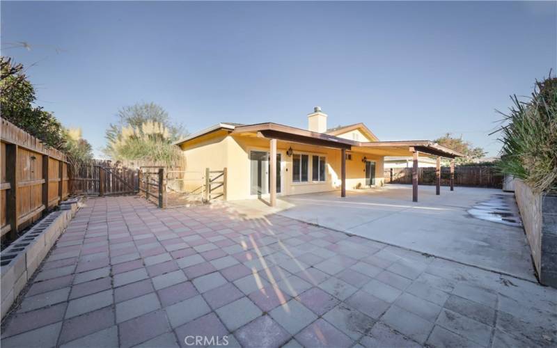 Cemented backyard with large Patio Cover