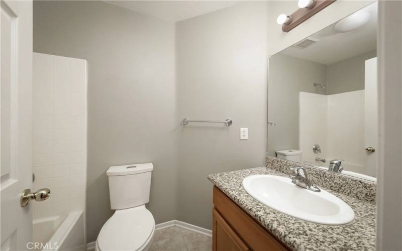 Bathroom in hallway across from Bedroom