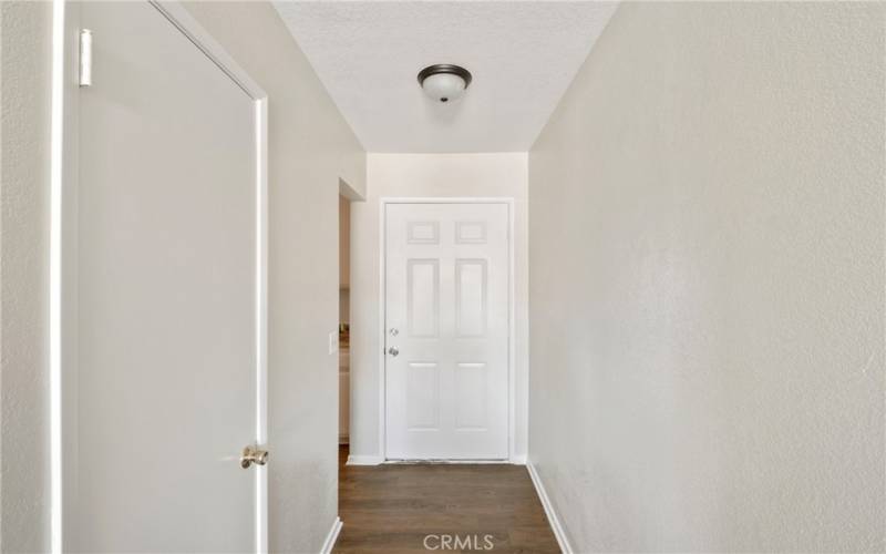 Front door entry fresh paint and laminate floors