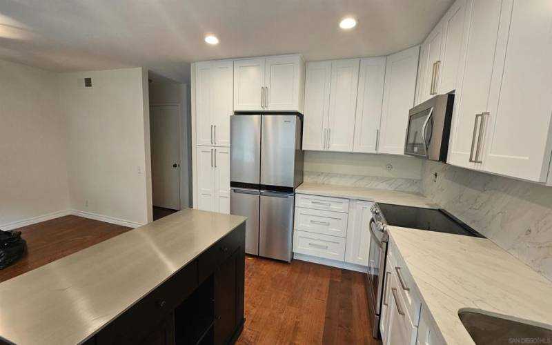 Just remodeled kitchen including new island, cabinet, refricgerator and range oven