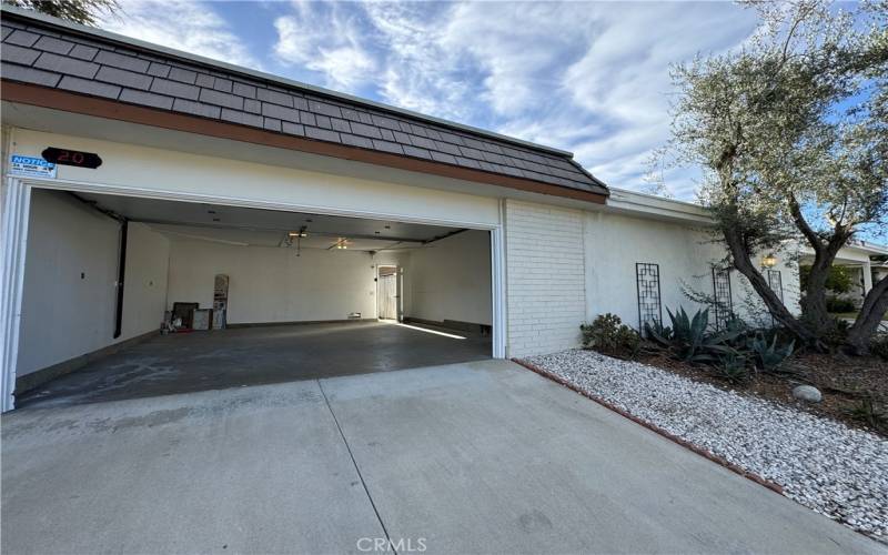 Single door garage that accomodate two cars