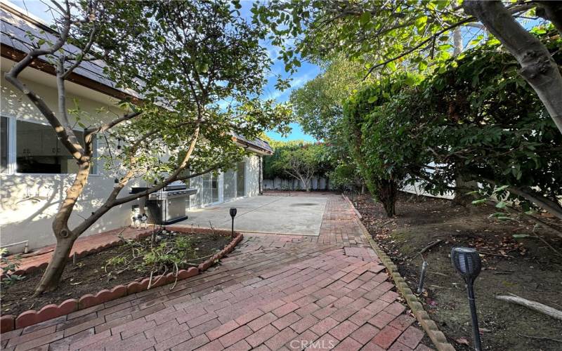 Back yard is lush and landscaped.