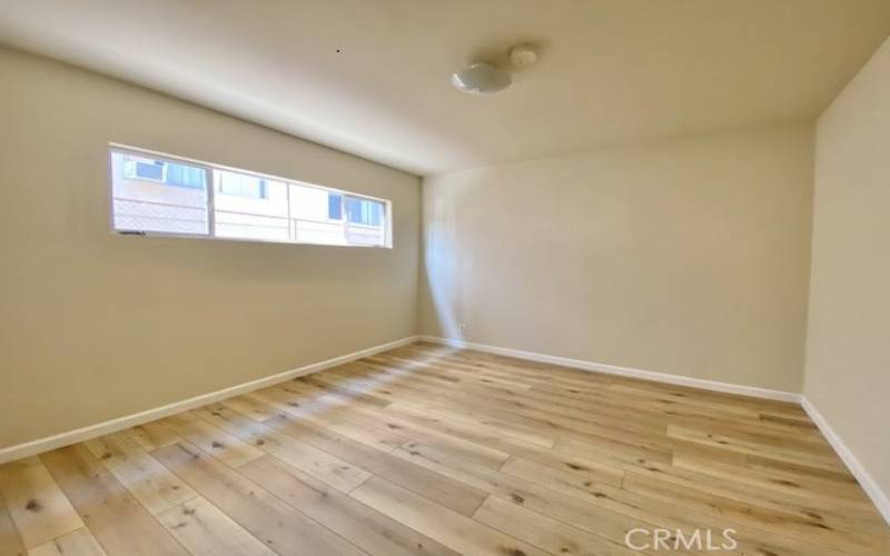 Bedroom with wood like flooring