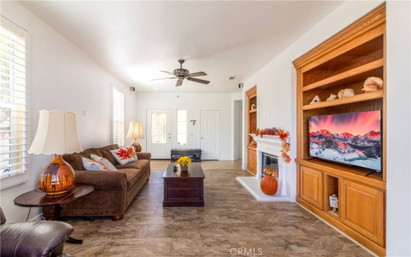 LIVING ROOM WITH BUILT-IN ENTERTAINMENT CENTER