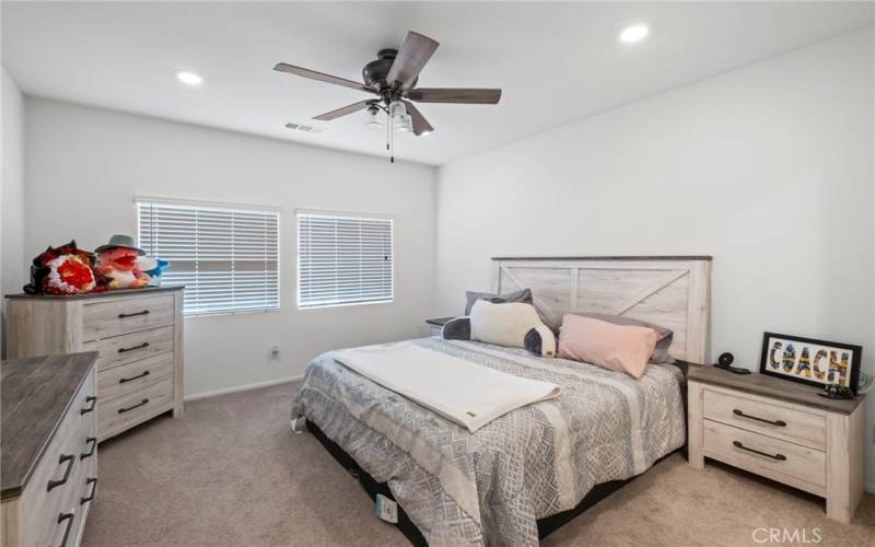 extra large main bedroom with custom ceiling fan.