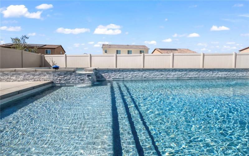 step down lounge area in the pool.