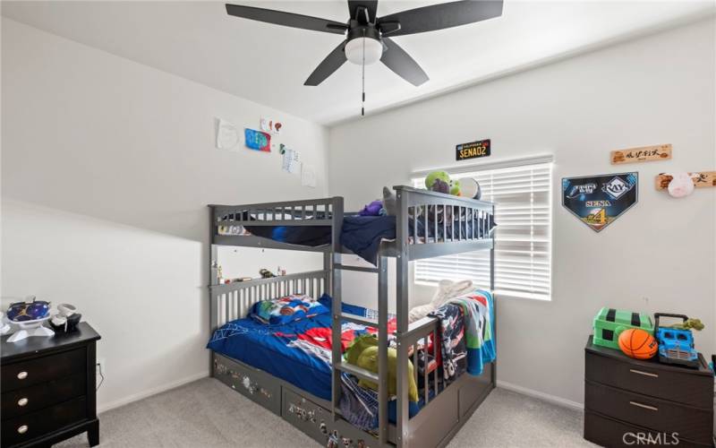 bedroom #3 with ceiling fan and it's own walk-in closet