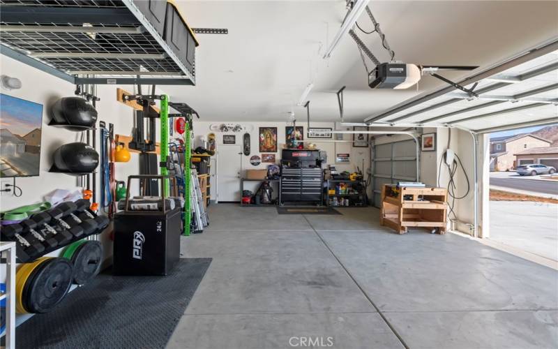 Three car garage and work space.