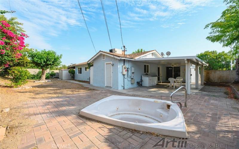 jacuzzi and long backyard