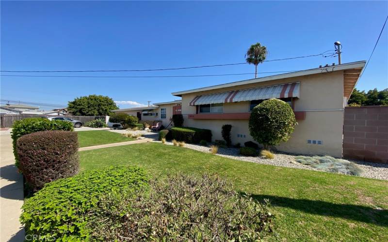 View from south front yard - very wide lot allows for 3 extra parking spot + 2 car garage