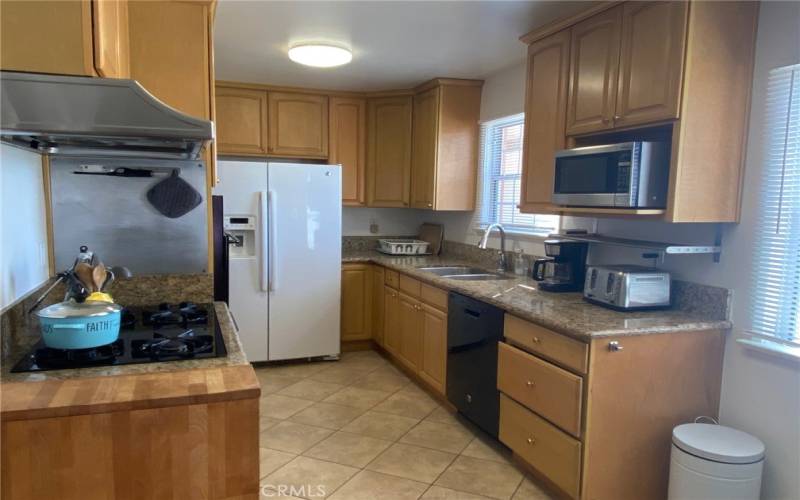 Beautifully Remodeled Kitchen - spacious & light w-Maple wood Cabinetry, granite counters and tile floor