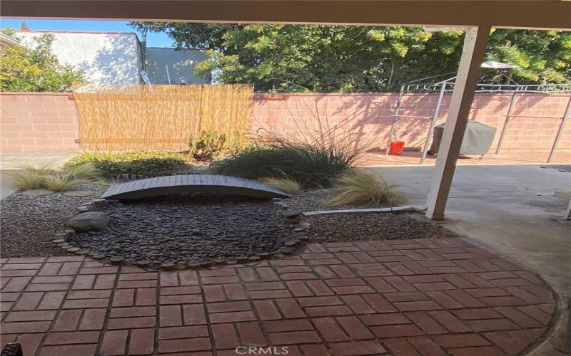 Covered court area & patio accessed from Family room