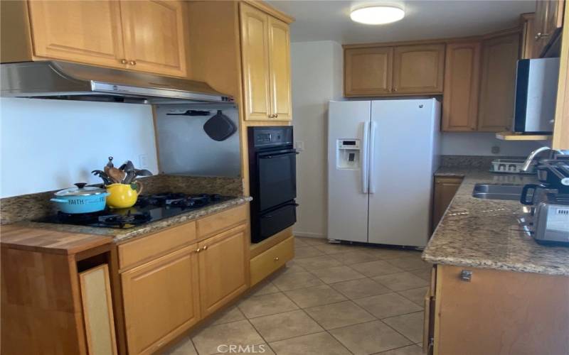 Beautifully Remodeled Kitchen - Maple wood Cabinetry, granite counters and tile floor