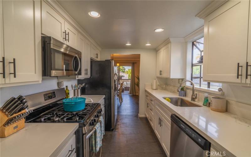 Kitchen separates Dining Room and Living Room